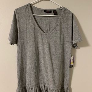 Woman’s gray V-neck T-shirt. Ruffle detail L
